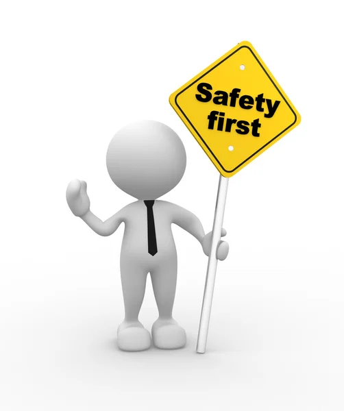 Man with a safety first sign in hand — Stock Photo, Image