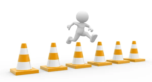 Man jumping over traffic cones — Stock Photo, Image