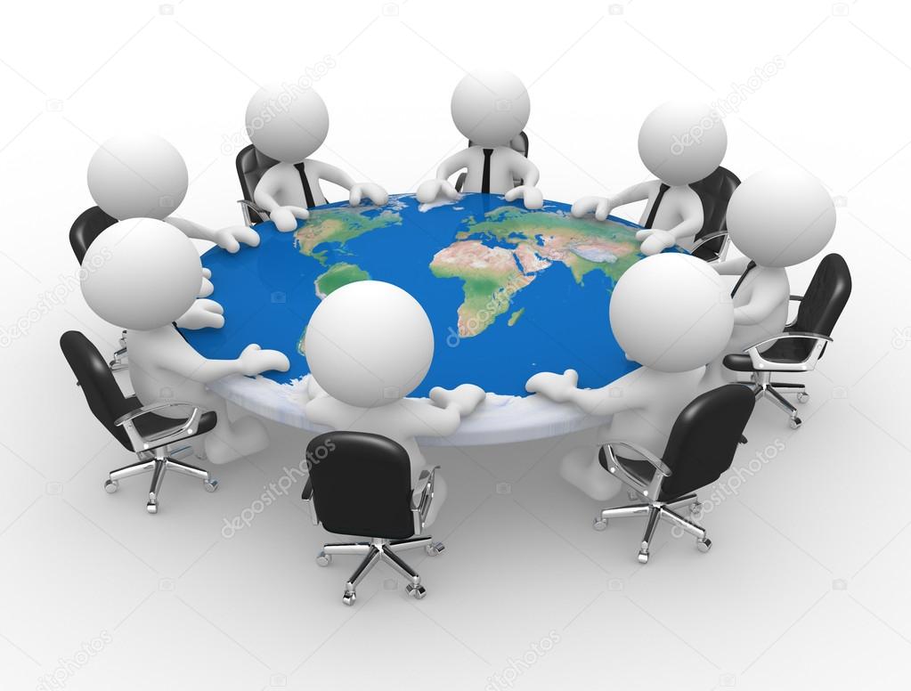 People at a conference table with world map.