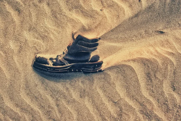 Boot covered in sand — Stock Photo, Image