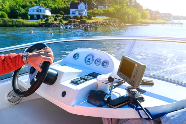 Captain's hand on steering wheel of motor boat — Stock Photo, Image