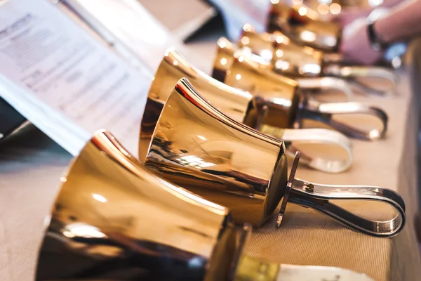 Handbells on table ready to perform — Stock Photo, Image