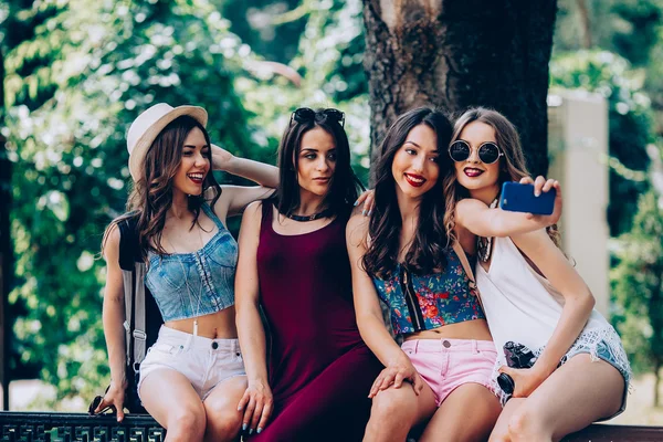 Four beautiful young girls make selfie — Stock Photo, Image