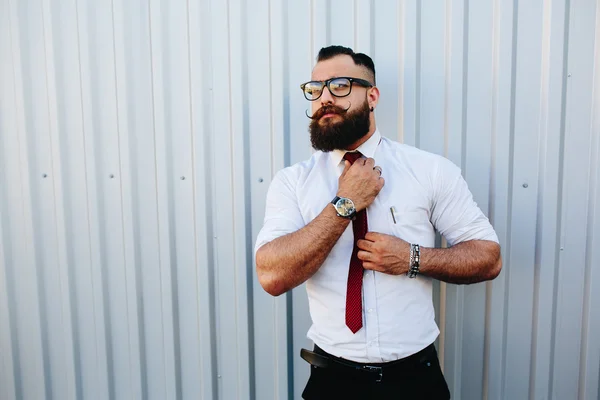 Businessman against a white wall — Stock Photo, Image