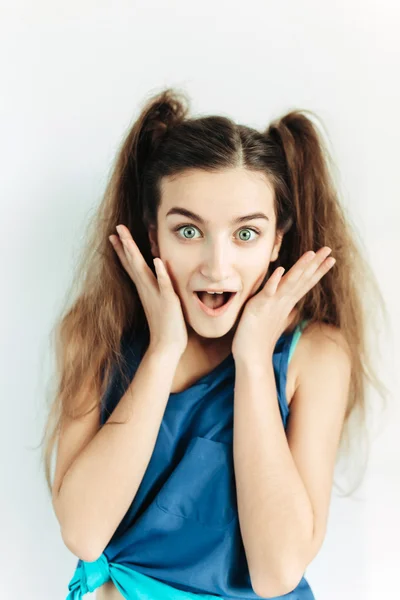 Surprised young girl with pigtails Stock Photo