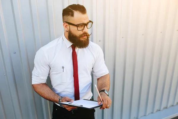 Businessman against a white wall — Stock Photo, Image