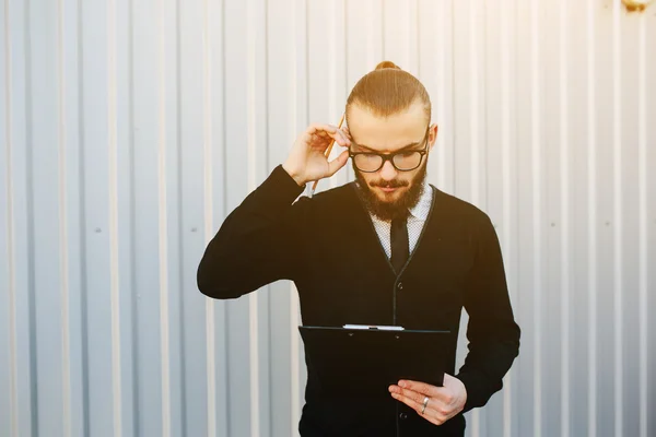 Businessman against a white wall — Stock Photo, Image