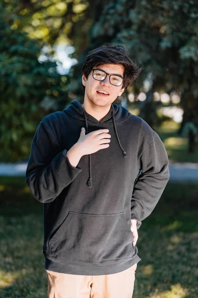 Portrait of happy young male student with glasses in casual outfit — Stock Photo, Image