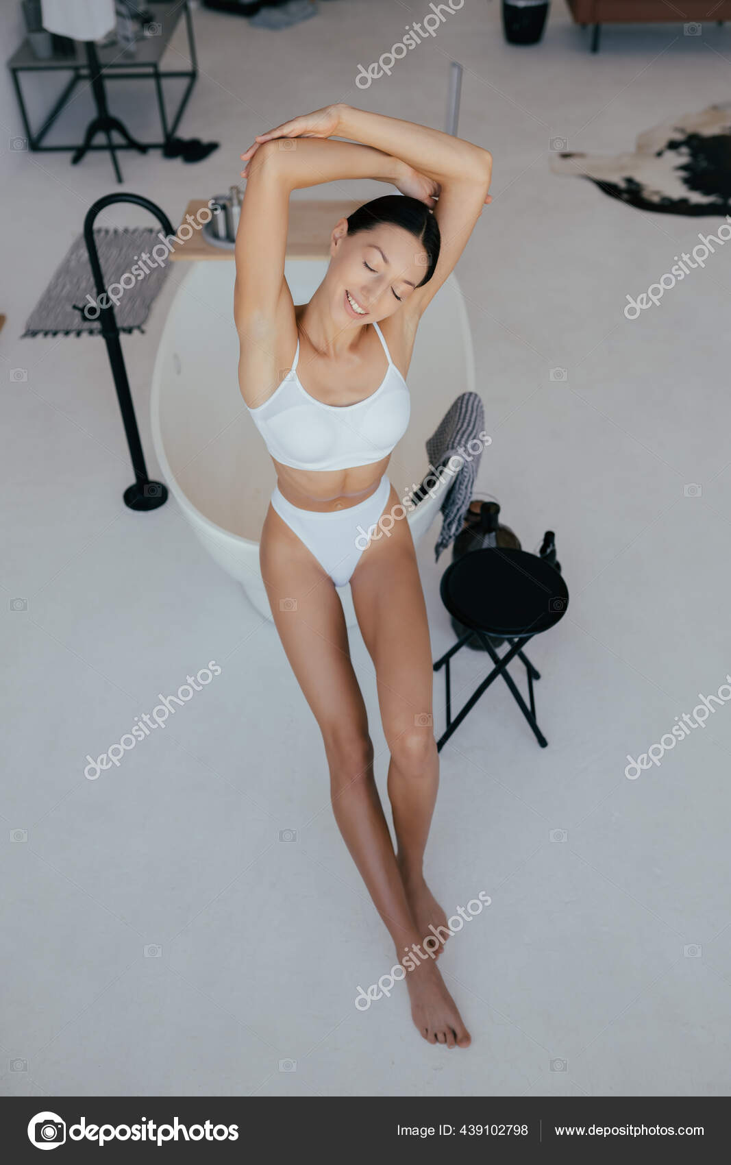 Mujer atractiva en lencería posando cerca fotografía de stock © simbiothy | Depositphotos