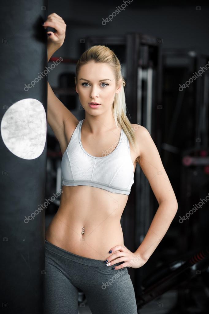 Girl in great shape in the gym Stock Photo by ©simbiothy 66070581