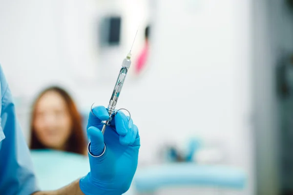 Dental anesthesia on a background of the patient Stock Photo