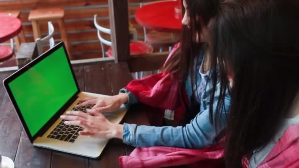 Two girls watching something in laptop — Stock Video