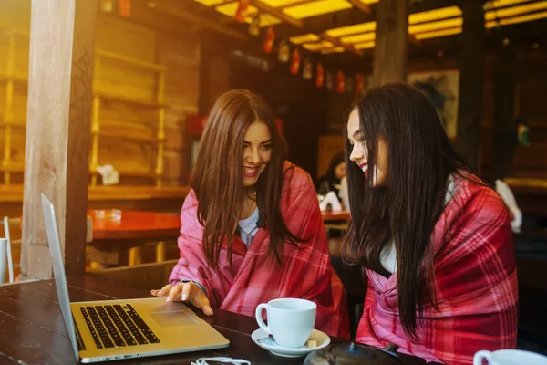 Two girls watching something in laptop — Stock Photo, Image