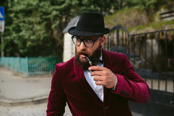 Rich man with a beard, thinking about business — Stock Photo, Image