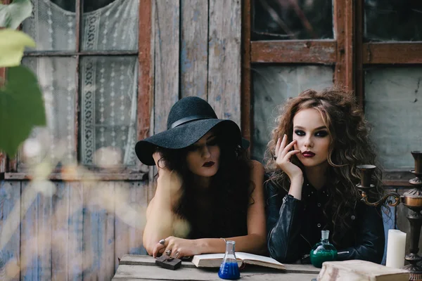 Two vintage witches perform magic ritual — Stock Photo, Image