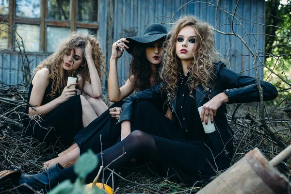 three vintage women as witches