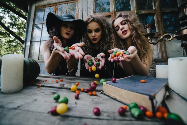 Three vintage witches perform magic ritual — Stock Photo, Image