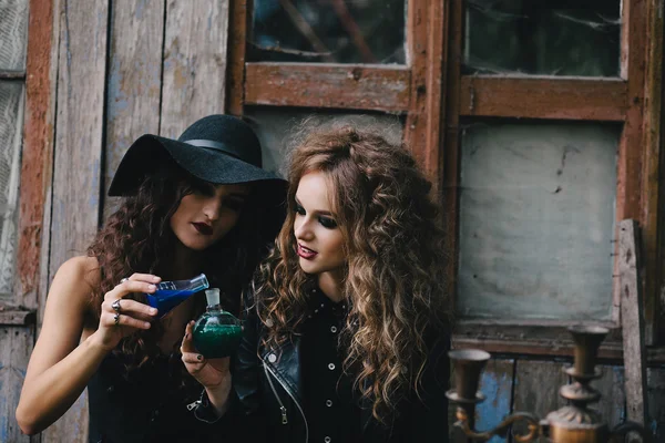 Two vintage witches perform magic ritual — Stock Photo, Image