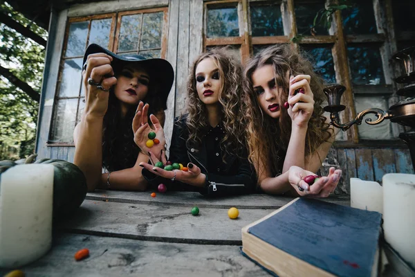 Three vintage witches perform magic ritual — Stock Photo, Image