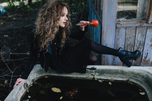 Vintage witch with elixir in hand — Stock Photo, Image