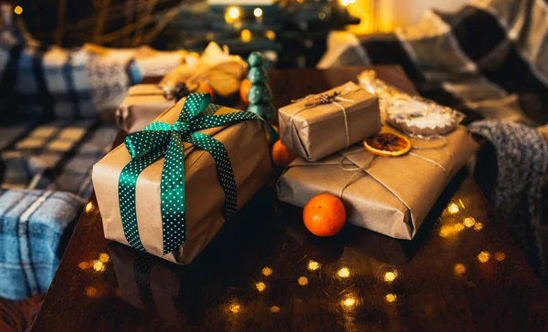 Beautiful themed gifts lie on wooden table — Stock Photo, Image