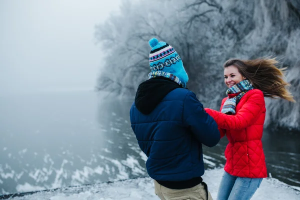 Beautiful couple having fun on the pier — Stock Photo, Image