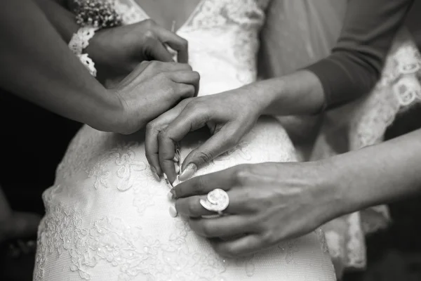 Bride putting on her dress — Stock Photo, Image