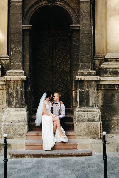 Bride sitting on lap of the bride — Stock Photo, Image