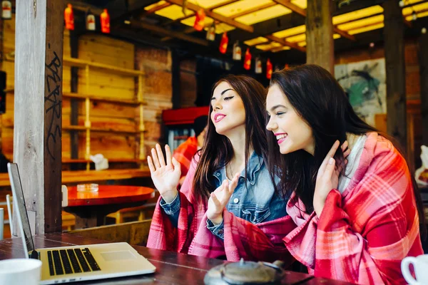 Two girls watching something in laptop — Stock Photo, Image