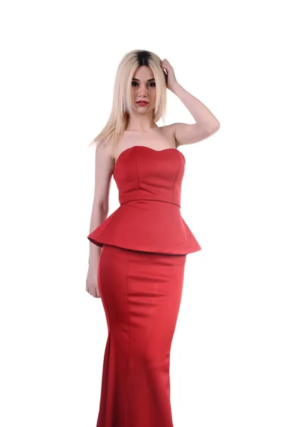 Beautiful fashion model stay in elegant pose, A sexy model in red dress is posing elastically, a cute model staying and looking down lovely