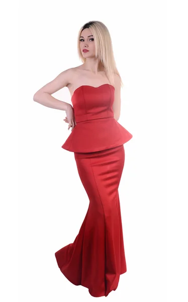 Beautiful fashion model stay in elegant pose, A sexy model in red dress is posing elastically, a cute model staying and looking down lovely