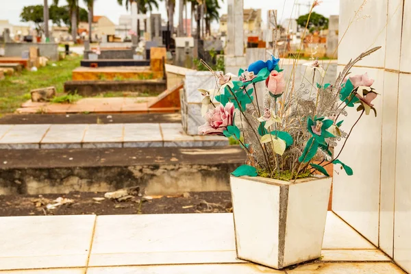 Detail of flowers on a grave in a cemetery in Goiania. Cemitrio Parque.
