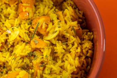 Rice with Brazilian Pequi. Detail of a crockery full of rice and pequi. Typical Brazilian food.