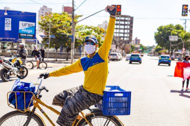 Brezilya Başkanı Bolsonaro 'ya karşı yapılan bir protesto sırasında çekilmiş bir fotoğraf. Aşı alımında görevi kötüye kullanmakla suçlanıyor..