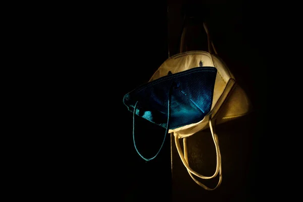 Some Protective Masks Hung Illuminated Just Beam Light Rest Scene — Stock Photo, Image