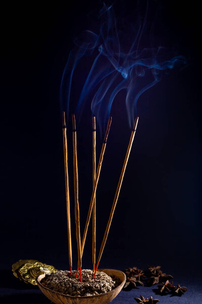 Friday 13. Some incense lit emitting a fragrant smoke with the intention of purifying the place.