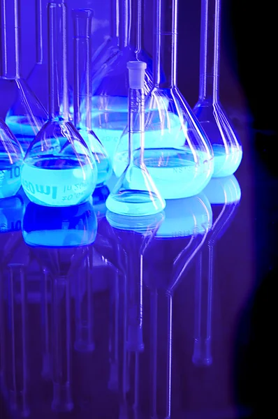 Test tubes in blue light — Stock Photo, Image