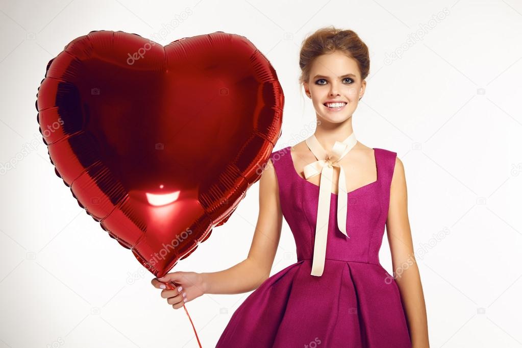 Beautiful girl in evening dress baloon red heart Valentine's day