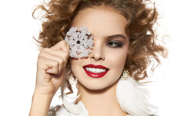 Beautiful girl with evening makeup smile take cristal snowflake — Stock Photo, Image