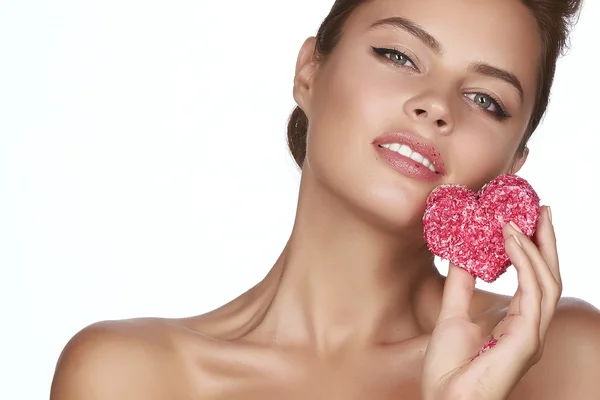 Beautiful sexy woman eating cake shape of heart valentine day — Stock Photo, Image