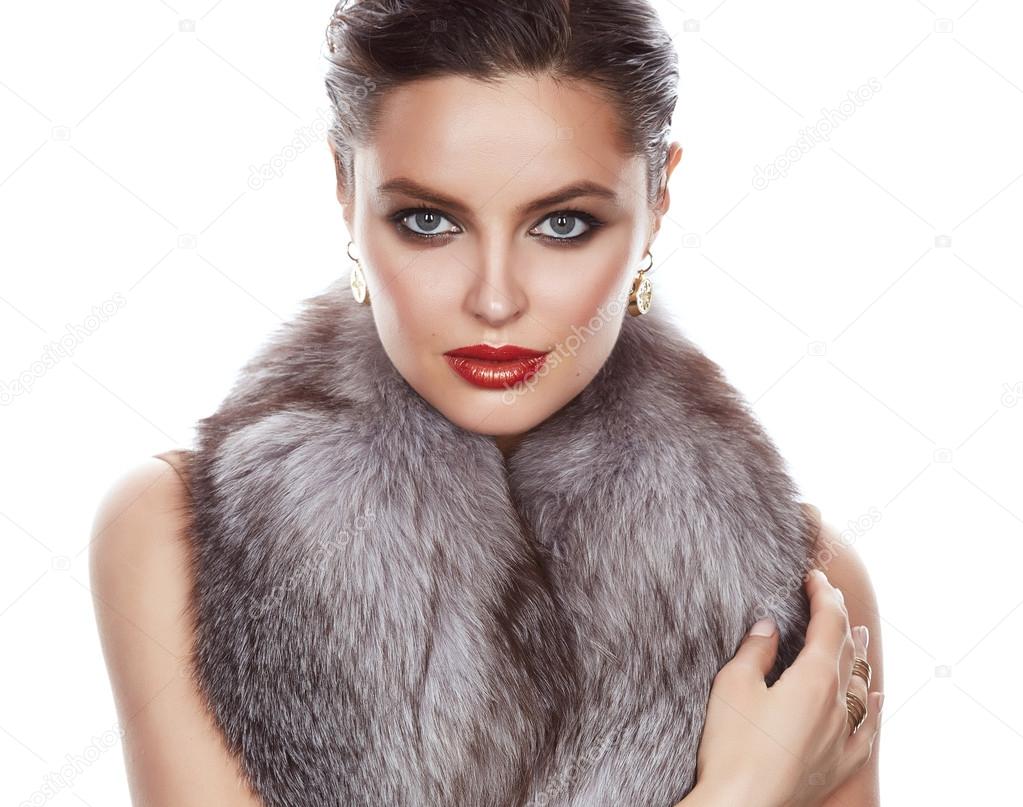 Beautiful sexy woman in furs makeup makeup jewelry 