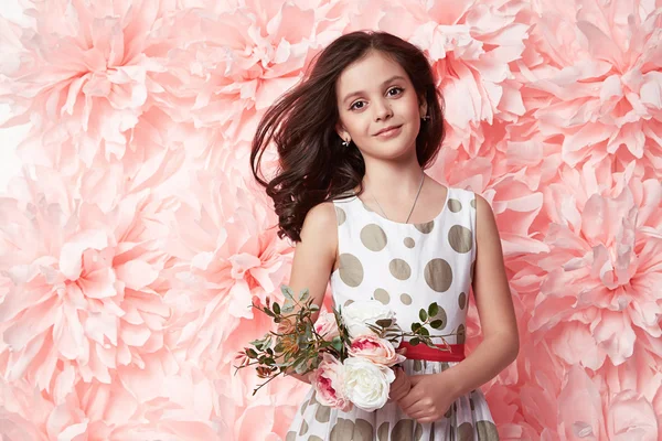 Beautiful little girl in cute dress with flower — Stock Photo, Image