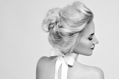Beautiful gentle woman with silk bow on neck cosmetics body face
