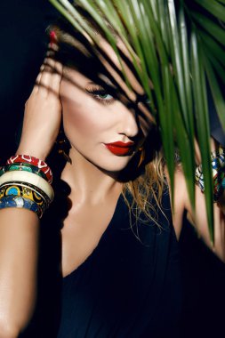 Beauty sexy woman makeup jungle palm sun tan shadows beach