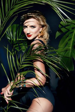 Beauty sexy woman makeup jungle palm sun tan shadows beach