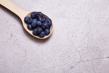 Wood spoon juicy ripe natural organic berries blueberries diet 
