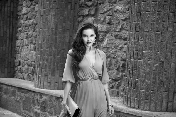 Beautiful sexy brunette woman walk silk dress party street — Stock Photo, Image