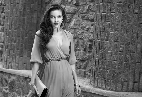 Beautiful sexy brunette woman walk silk dress party street — Stock fotografie