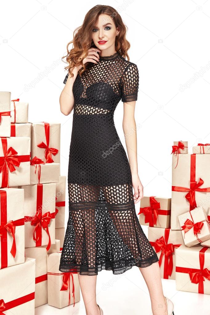 Beautiful young sexy woman thin slim figure evening makeup fashionable stylish dress, clothing collection, brunette, gifts boxes red silk bows holiday party birthday New Year Christmas Valentine's Day