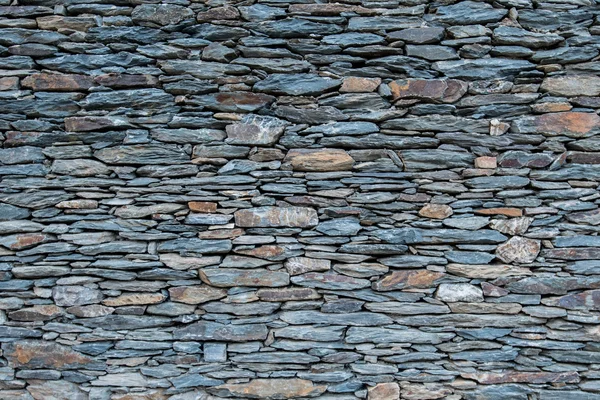 Mur de pierre serré empilée — Photo